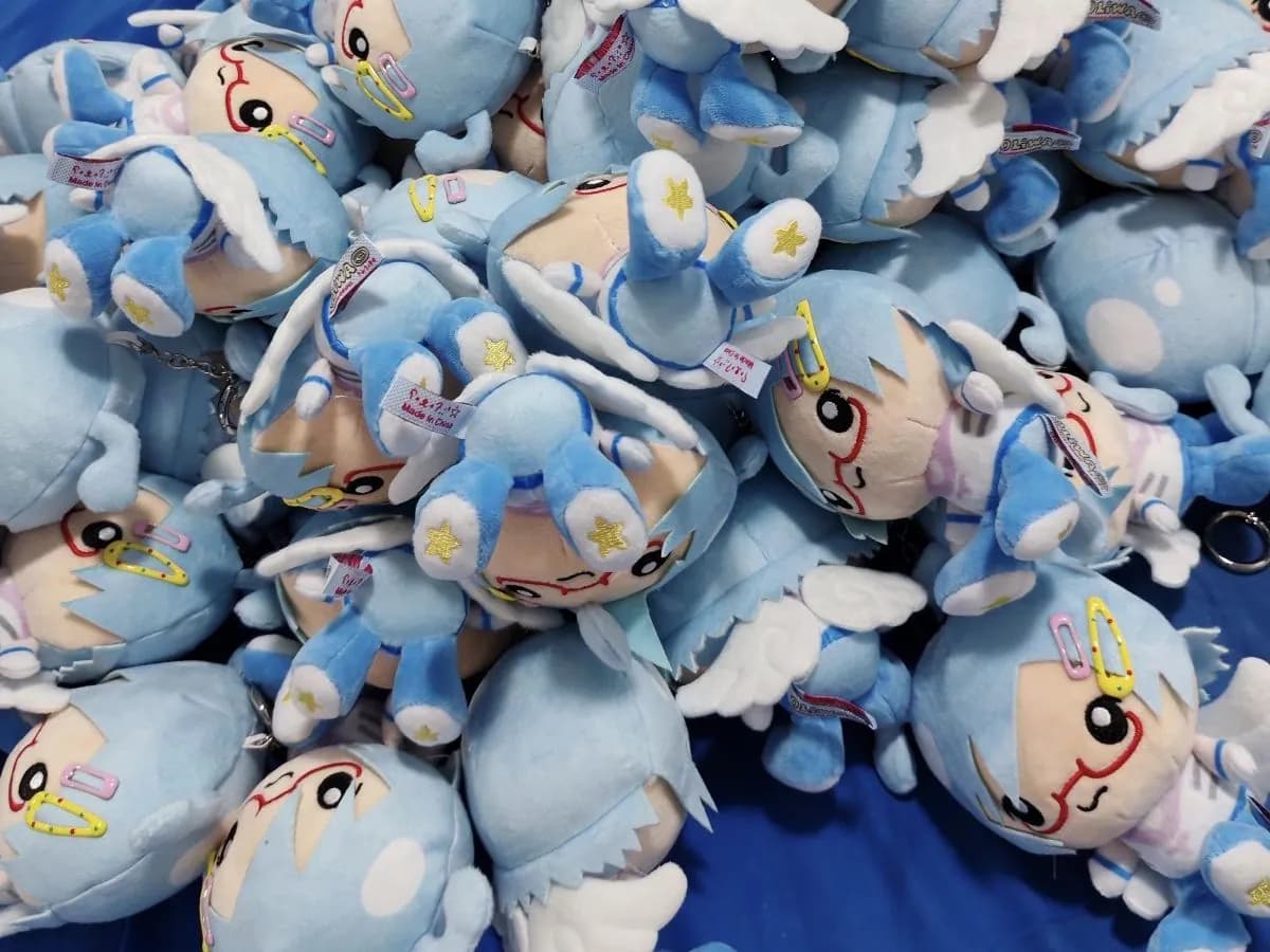 Bulk run of pale blue character charms after sewing