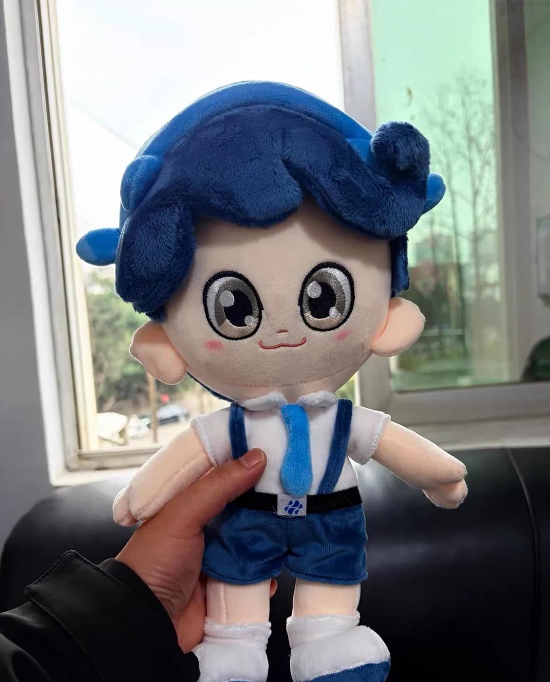 Cotton doll with blue wefted hair in a school uniform