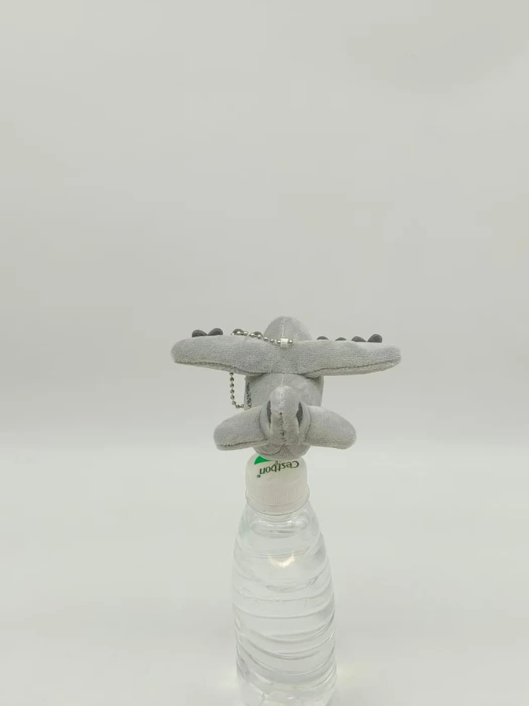 Aircraft character plush photographed head-on, showing the nose panels